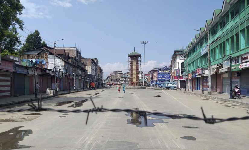File image of Kashmiri women walking at a deserted Lal Chowk square, a frequent site for anti-India protests, in Srinagar. AP