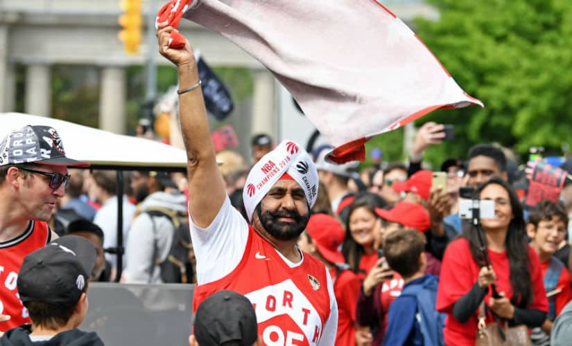 Toronto Raptors fan Nav Bhatia celebrates with fans during the Toronto Raptors Championship Parade on Lakeshore Boulevard. Reuters