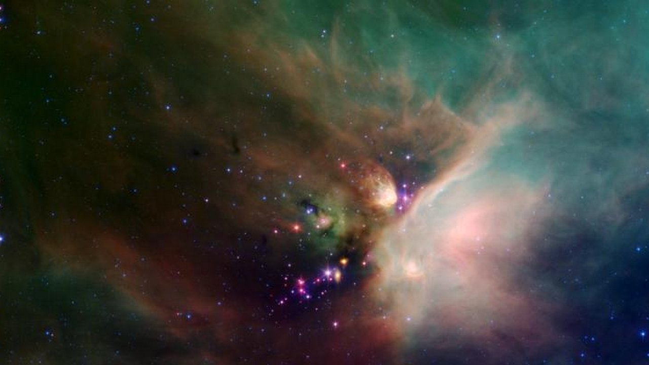 This is an image of the Rho Ophiuchi nebula which is located 400 light-years away from the Earth. One can see newborn stars peeking out from beneath the blanket of dust. This region is also one of the closest star-forming regions in the solar system. Image credit: NASA/JPL This is an image of the Rho Ophiuchi nebula which is located 400 light-years away from the Earth. One can see newborn stars peeking out from beneath the blanket of dust. This region is also one of the closest star-forming regions in the solar system. Image credit: NASA/JPL