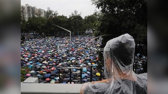 Hong Kong pro-democracy protesters march in show of 'peaceful' credentials as China takes hardline tone, issues warnings to 'terrorist-like' activities