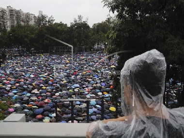 Hong Kong pro-democracy protesters march in show of 'peaceful' credentials as China takes hardline tone, issues warnings to 'terrorist-like' activities Hong Kong pro-democracy protesters march in show of 'peaceful' credentials as China takes hardline tone, issues warnings to 'terrorist-like' activities