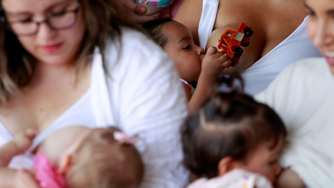 Mothers nurse their children to mark the World Breastfeeding Week to promote global support for breastfeeding in Ciudad Juarez, Mexico August 4, 2018. REUTERS/Jose Luis Gonzalez - RC117D9A0EE0
