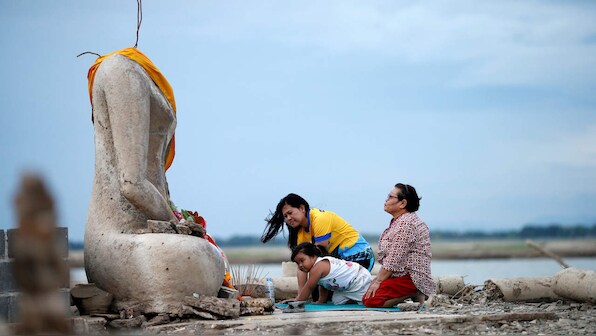 Drought in Thailand exposes submerged Buddhist temple after dam water levels recedes