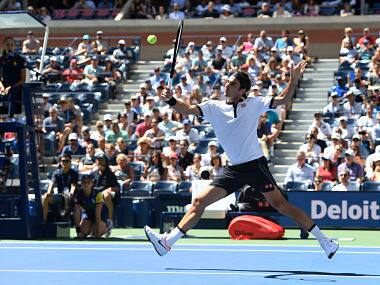 Roger Federer, of Switzerland, returns a shot to Daniel Evans, of the United Kingdom, during round three of the US Open tennis championships Friday, Aug. 30, 2019, in New York. (AP Photo/Sarah Stier)