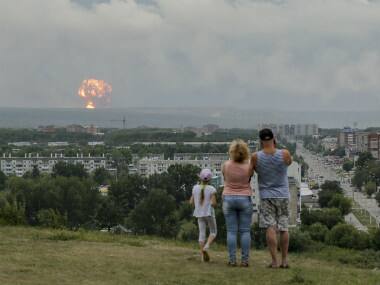 Powerful explosions at Siberian military depot injure 12; Russian military to send 10 heavy transport planes and helicopters to extinguish blaze
