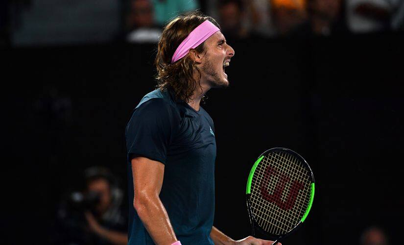 Greece’s Stefanos Tsitsipas reacts after a point against Spain’s Rafael Nadal during their men’s singles semi-final match on day 11 of the Australian Open tennis tournament in Melbourne on January 24, 2019. (Photo by Paul Crock / AFP) / – IMAGE RESTRICTED TO EDITORIAL USE - STRICTLY NO COMMERCIAL USE –
