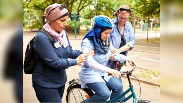 Wheels of change: In Germany, local initiatives help refugee women feel at home, one bicycle ride at a time