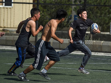 Away from better known sports in cricket and football, war-hardened kids in Afghanistan find a new sport: Rugby Away from better known sports in cricket and football, war-hardened kids in Afghanistan find a new sport: Rugby