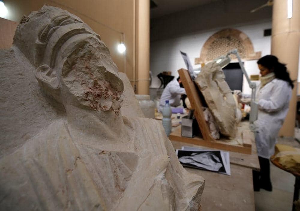 Specialists work on damaged statues from Palmyra at Syria’s National Museum of Damascus in January 2019. Image credit: Reuters/Omar Sanadiki