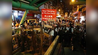 Hong Kong pro-democracy protesters apologise for 'reckless' violence at airport; China says demonstrations 'near terrorism'