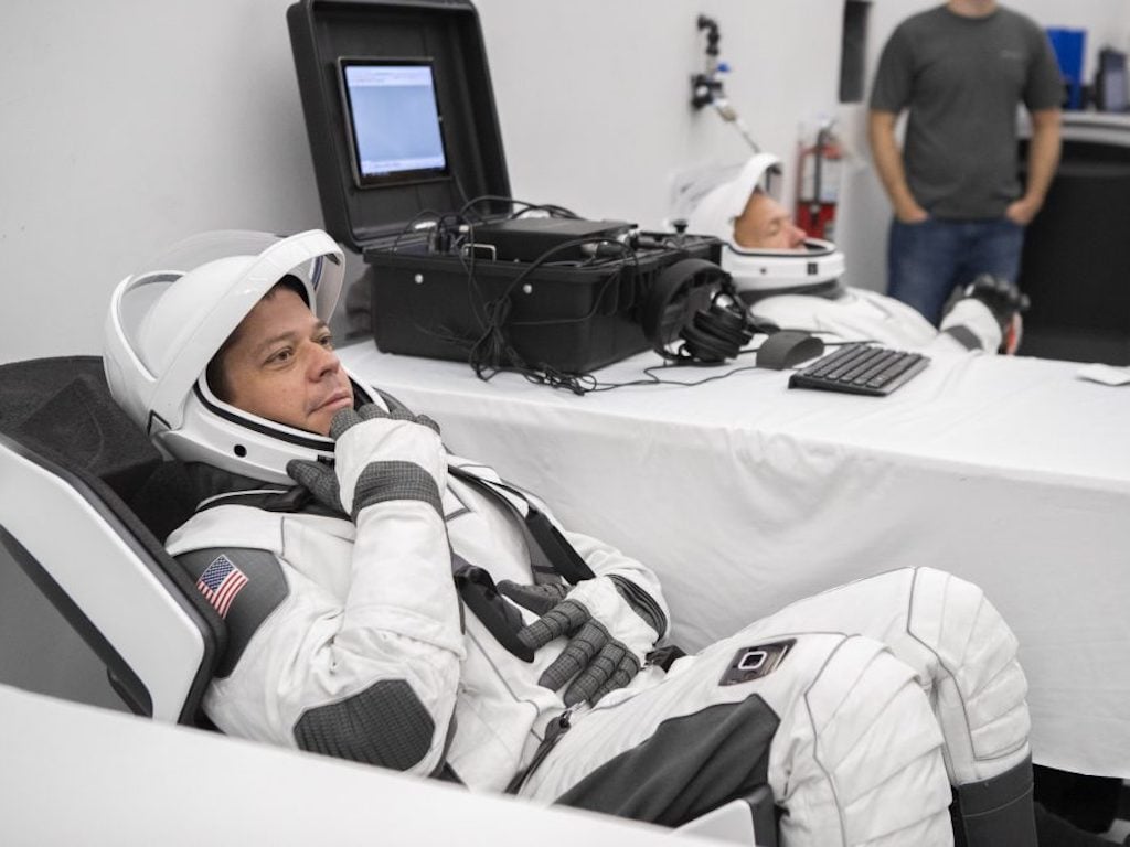 NASA astronaut Bob Behnken simulates a Crew Dragon launch at SpaceX headquarters. Image: NASA