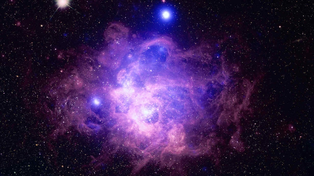 This is the nearby galaxy Messier 33 contains a star-forming region called NGC 604 where some 200 hot, young, massive stars reside. Chandra's data is combined with data from Hubble. Image credit: NASA/CXC