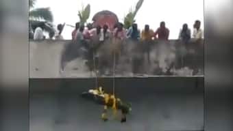 Video of Dalit man's body being lowered from bridge for cremation goes viral after upper caste Hindus deny access through land