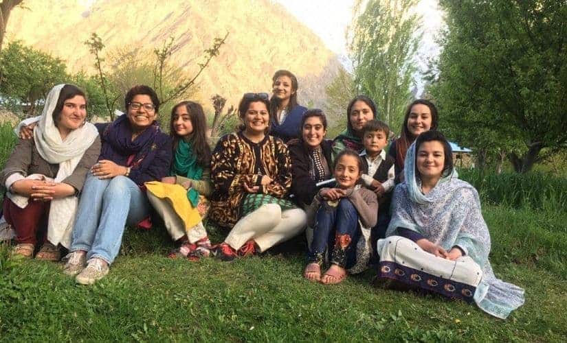 The Climate Stories Pakistan team with a family in Sonoghur Valley, Chitral. Image courtesy: Climate Stories Pakistan/National Geographic Society.