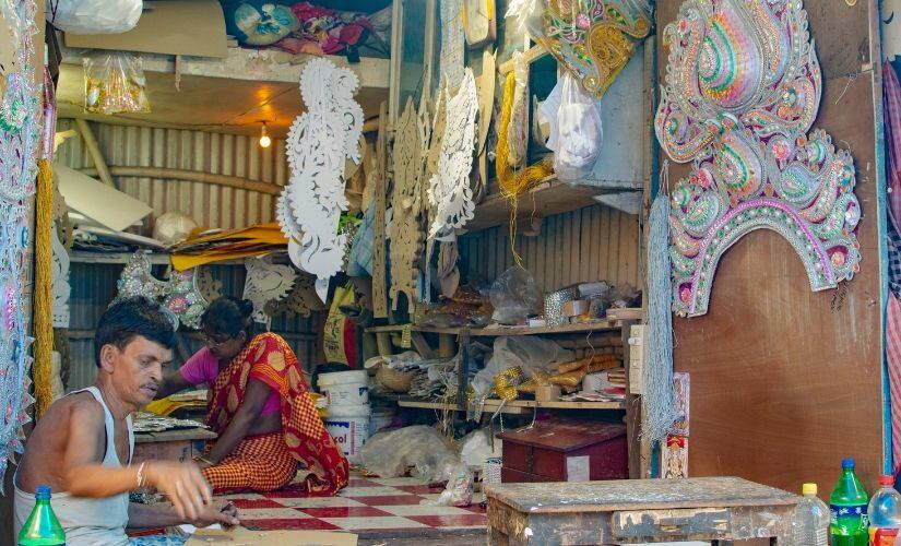Pintu Majumdar and Krishna Pal, artisans from Kolkata's Kumortuli, make some of the last batches of jewellery ordered for Durga idols this year. 