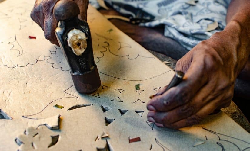 The jewellery is made of cardboard, thermocol, beads, sequins, all of which are put together either with glue, or by stitching.
