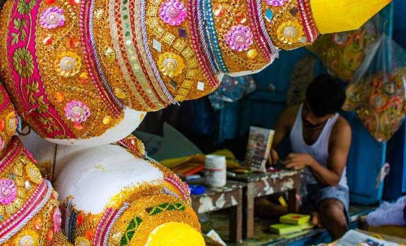 A jewellery artisan at work in Kumortuli.