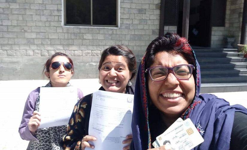 “Three lone girls” celebrate after obtaining an NOC to cross the Immit checkpost in District Ghizer in order to reach the Ishkumen Valley. Image courtesy: Climate Stories Pakistan/National Geographic Society.