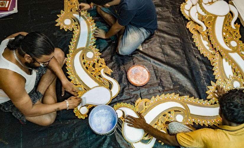 Prasun Dey (left) and his employees at work.