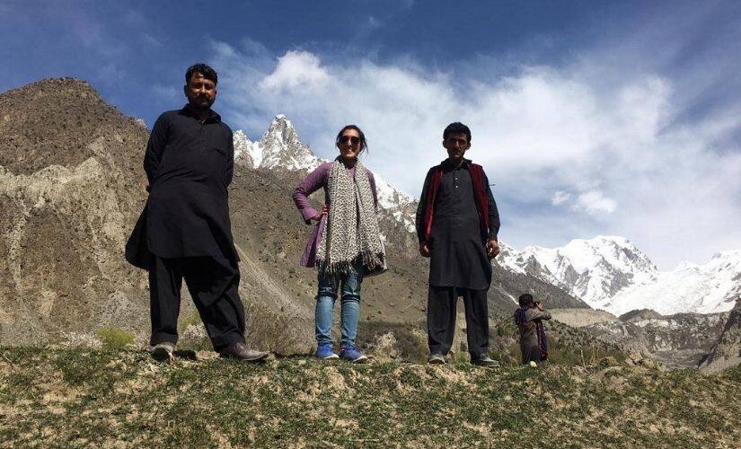 (L-R) Our driver Ahmed, team lead Amber, and Reza Ali near a glacier in Badswat, District Ghizer. Image courtesy: Climate Stories Pakistan/National Geographic Society.