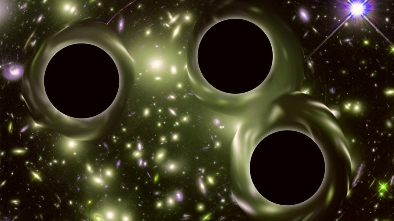 A concept artwork of 3 black holes. Image: Flickr NASA Goddard Jordan Pearson