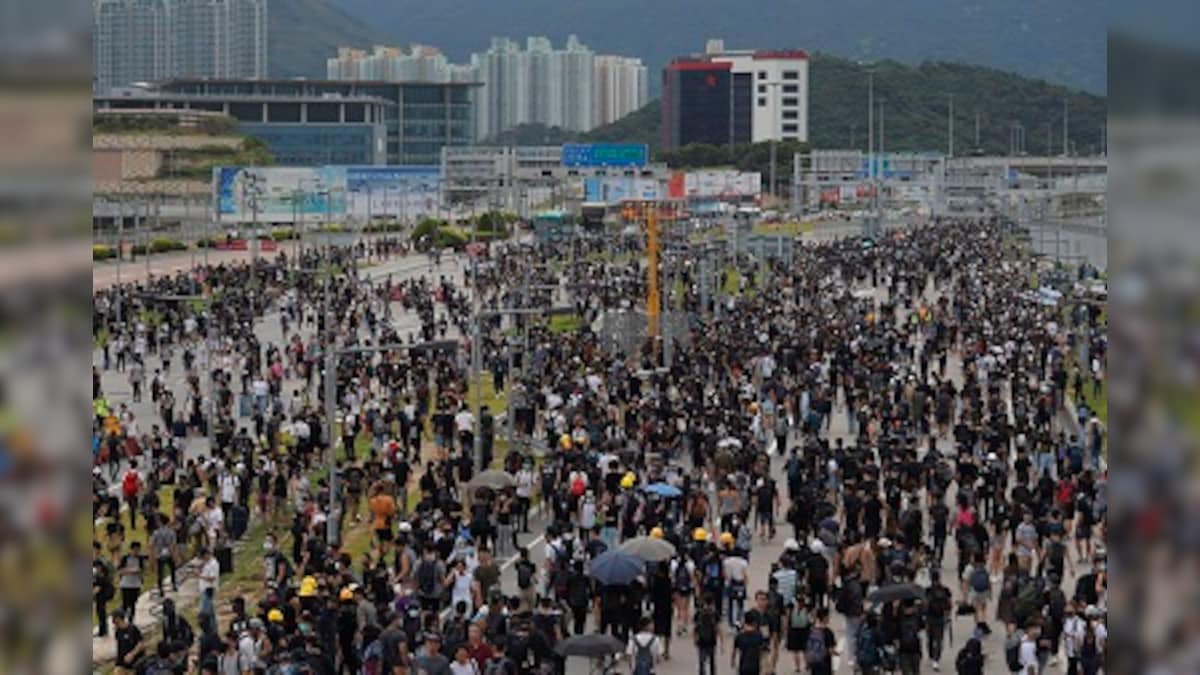 Hong Kong's pro-democracy protesters disrupt air travel; train, bus services suspended after violent clashes with police