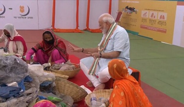 Saying Om or cow is not regressive, says Narendra Modi in Mathura; PM interacts with garbage workers, tells people to shun single-use plastic Saying Om or cow is not regressive, says Narendra Modi in Mathura; PM interacts with garbage workers, tells people to shun single-use plastic