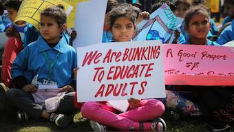 Millions of students, adults take to streets demanding change in vast global climate strike on 20 September