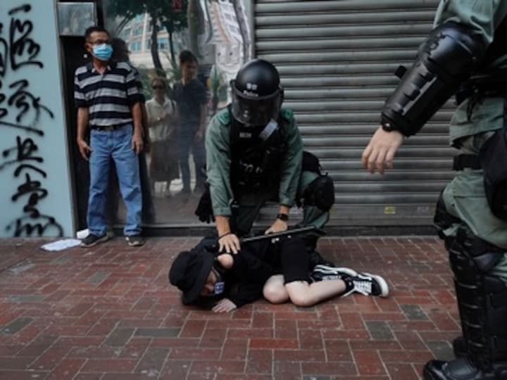 Hong Kong democracy activists challenge emergency law in court which bans masks ahead of Halloween rally