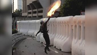 Hong Kong protests: Police fires water cannons, tear gas after protesters hurl petrol bombs at govt buildings in Admiralty district