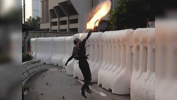 Hong Kong protests: Police fires water cannons, tear gas after protesters hurl petrol bombs at govt buildings in Admiralty district