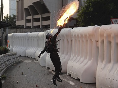 Hong Kong protests: Police fires water cannons, tear gas after protesters hurl petrol bombs at govt buildings in Admiralty district Hong Kong protests: Police fires water cannons, tear gas after protesters hurl petrol bombs at govt buildings in Admiralty district