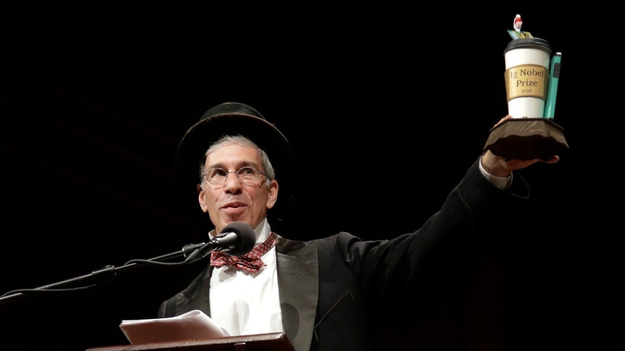 Marc Abrahams, editor & co-founder of 'Annals of Improbable Research', originator & emcee of the annual Ig Nobel Prizes, holds up the 2019 Ig Nobel award at the 29th annual Ig Nobel awards ceremony at Harvard University on 12 September 2019. AP