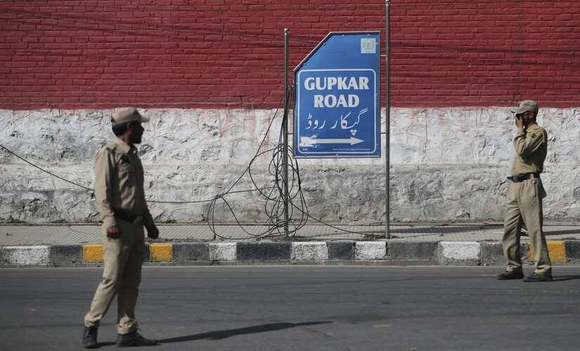 Indian policemen stand guard in Srinagar. AP