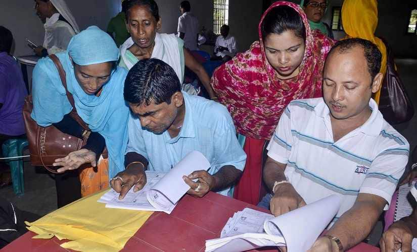 People check their names on the National Register of Citizens (NRC) final list at a NRC centre in Buraburi Gaon, Morigaon, Assam. PTI