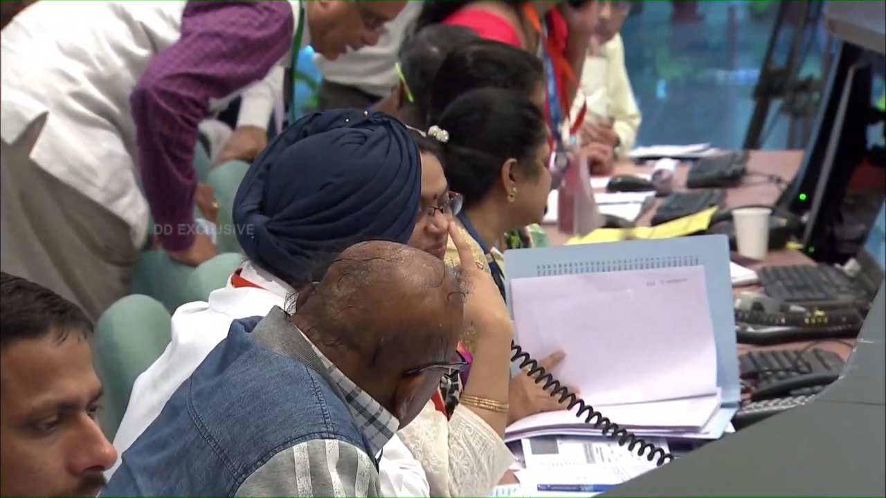 ISRO officials exchanging notes after the Vikram lander fell silent. Image: ISRO