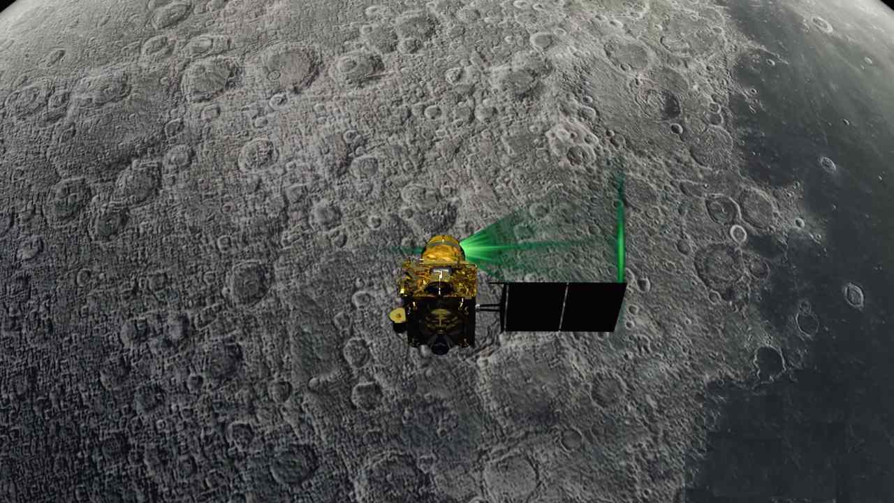 An illustration of Chandrayaan 2 orbiter at work studying the luner surface