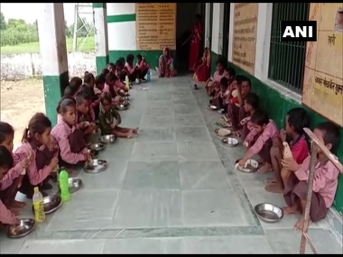 Uttar Pradesh govt files case against journalist for video of children eating salt, roti in mid-day meal; says purpose was to 'malign' Uttar Pradesh govt files case against journalist for video of children eating salt, roti in mid-day meal; says purpose was to 'malign'