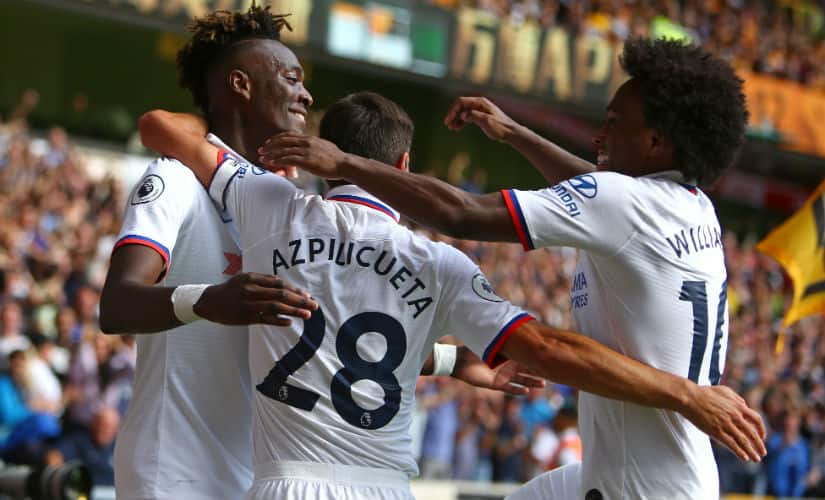 Tammy Abraham (L) celebrates with teammates after scoring their fourth goal, his third during the English Premier League football match between Wolverhampton Wanderers and Chelsea at the Molineux stadium in Wolverhampton, central England on September 14, 2019. AFP