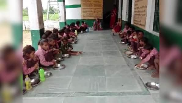 UP journos protest FIR against colleague for exposing substandard mid-day meal; will examine plaint, says govt