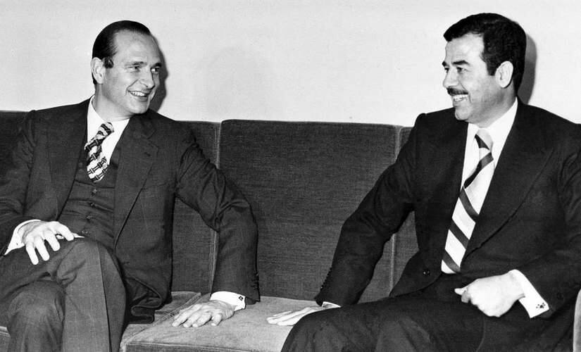 File image of French ex-president Jacques Chirac and Saddam Hussein. AP