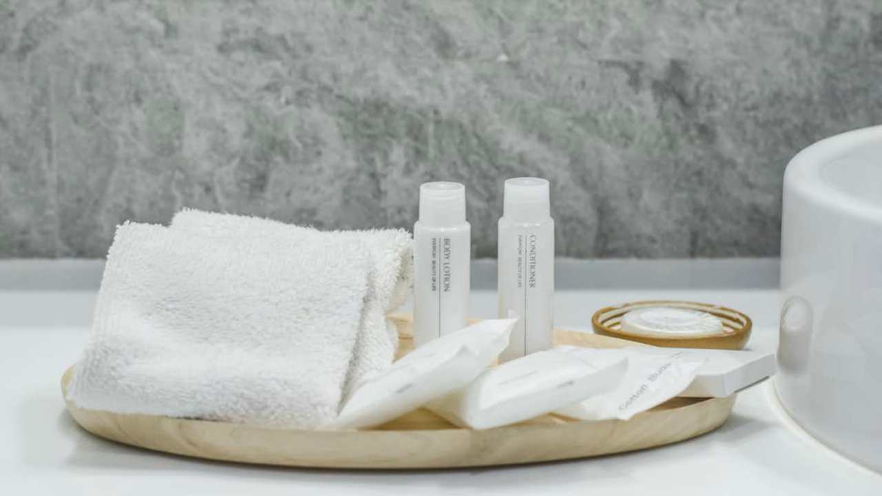 InterContinental Hotels Group is considering flushing their mini-toiletries down the drain and replacing them with bulk items. image credit: KR_Netez/Shutterstock.com