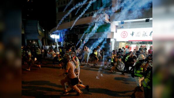 Hong Kong riot police deployed near railway-station-turned-airport to curb protest after violent street clashes