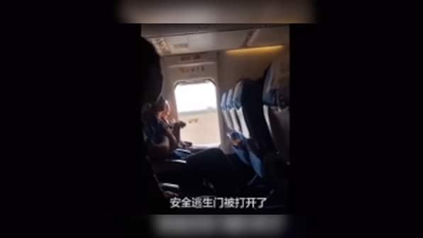 Woman aboard China's Xiamen Airlines opens flight's emergency door because she felt 'too stuffy', delays flight for an hour