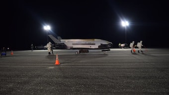 US Air Force mystery space plane lands at the space center after its two year mission