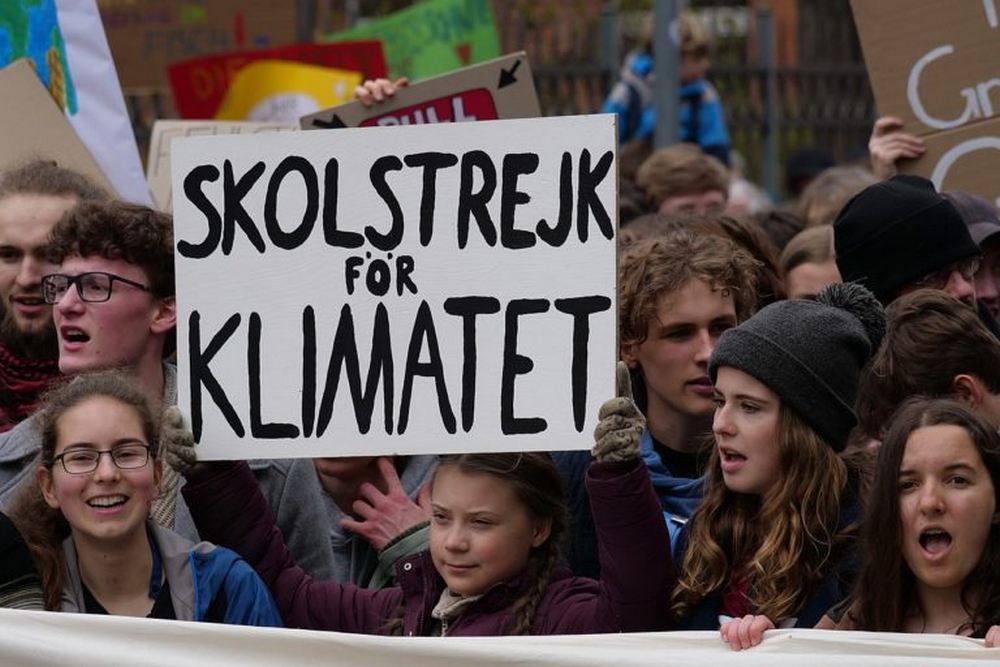 Greta Thunberg at the front banner of the FridaysForFuture demonstration Berlin in 2019. Image credit: Leonhard Lenz/Wikimedia Commons.