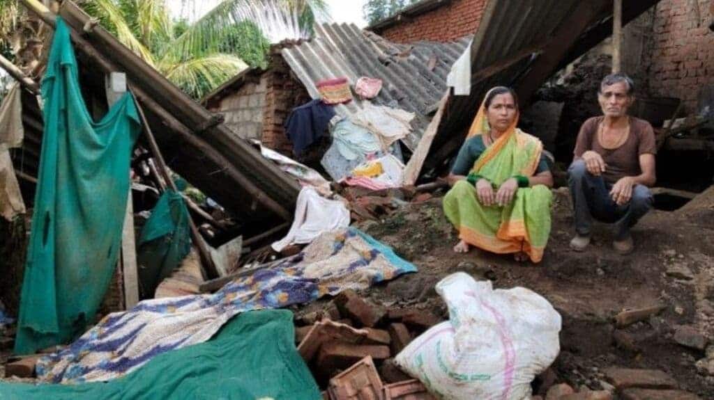 A couple stares at their collapsed house, Kothli, Karvir Taluka, Kolhapur. Photo by Kanchan Srivastava.