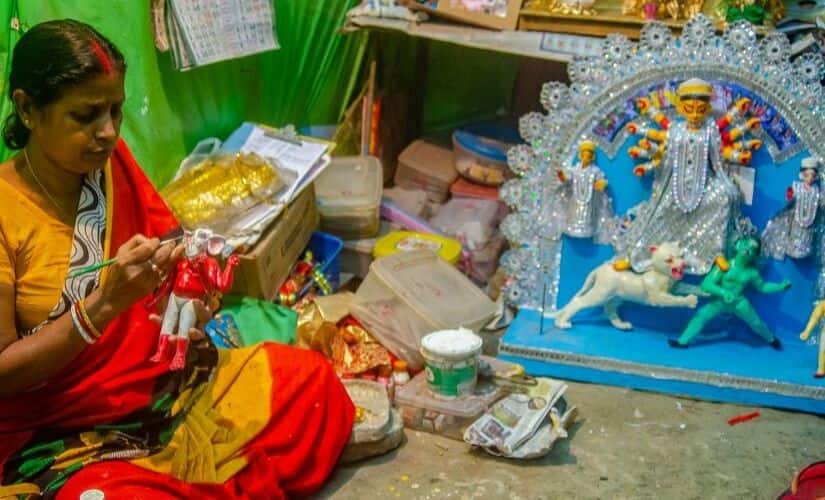 Mala Pal putting the finishes touches to a Ganesh idol.