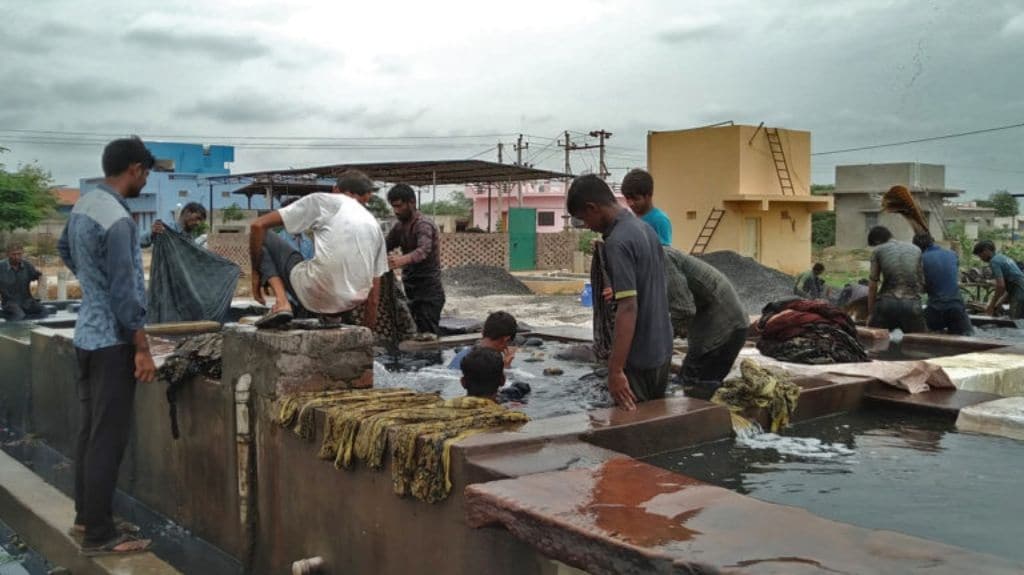 Washing of the cloth takes place in a community washing area. Photo by Azera Parveen Rahman.