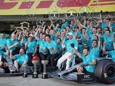 Winner Valtteri Bottas and third placed Lewis Hamilton celebrate with Mercedes crew at their garage after the Japanese Grand Prix. AP